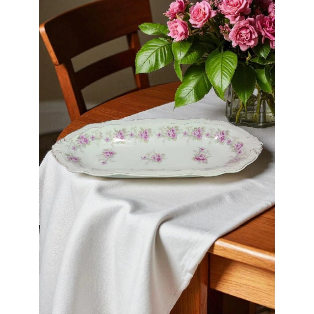 The Vintage Z&S Bavaria Hand Painted Floral Porcelain Relish Celery Serving Dish is a charming and unique piece of...