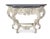 Inspired by an 18th Century Louis XV elaborately carved console with a black honed marble top exemplifies the Rococo...