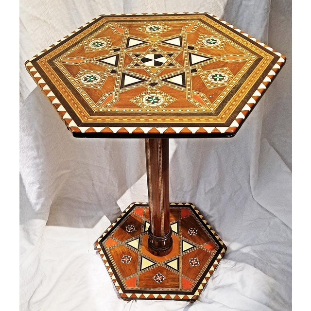 What a spectacle of inlay, Moroccan hand made hexogonal teak pedestal table completely covered in parquetry inlay of...