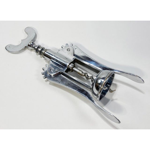 Vintage Italian silverplate corkscrew. Marked "ITALY" on handle. Good working condition. Natural vintage age wear to metal.