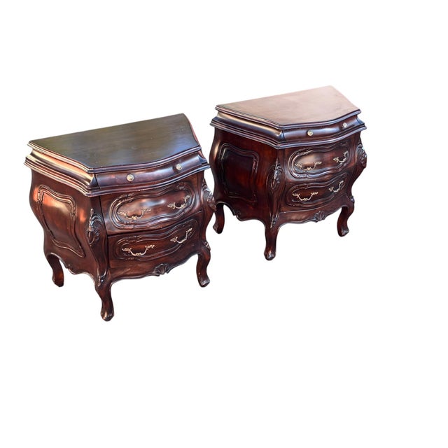 Title: Pair of Louis XV Style Bombe Nightstands Handsome pair of Louis XV–style bombe nightstands featuring dramatically...