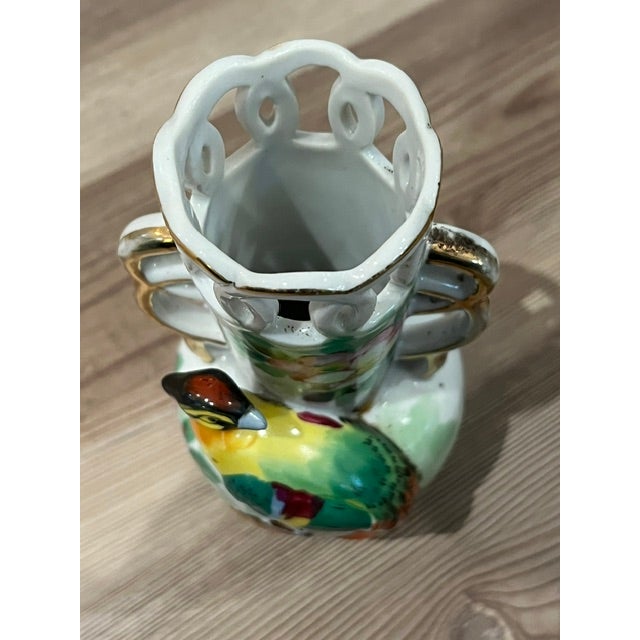 Vintage porcelain or ceramic bud vase made in Occupied Japan, featuring a 3D figural pheasant, hand-painted floral motifs,...