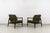 A pair of GFM-64 armchairs designed by Edmund Homa, produced by the Gościcińska Fabryka Mebli (GFM) in Poland during the...