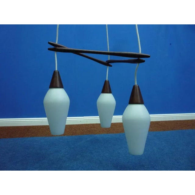 Very fine hanging lamp with 3 glass flasks. Makes a beautiful light. The wiring was extended some time ago to 180cm. Very...