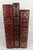 A handsome collection of three vintage Easton Press leather-bound literary classics, presented in rich burgundy and red...