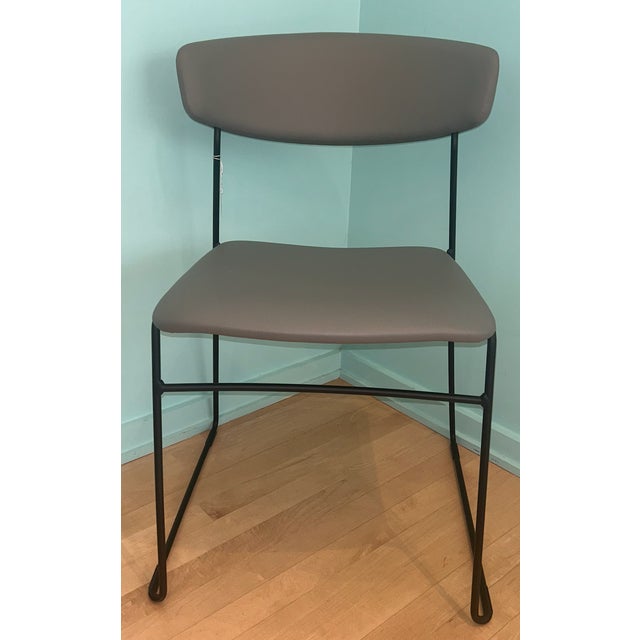 Wolfgang metal chair by Fornasarig. Designed by Luca Nichetto. Seat and back are both upholstered in ecoleather. The sled...