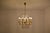 A fantastic 20th-century Italian vintage 10-light chandelier from the 1950's hanging via a slender solid brass structure....