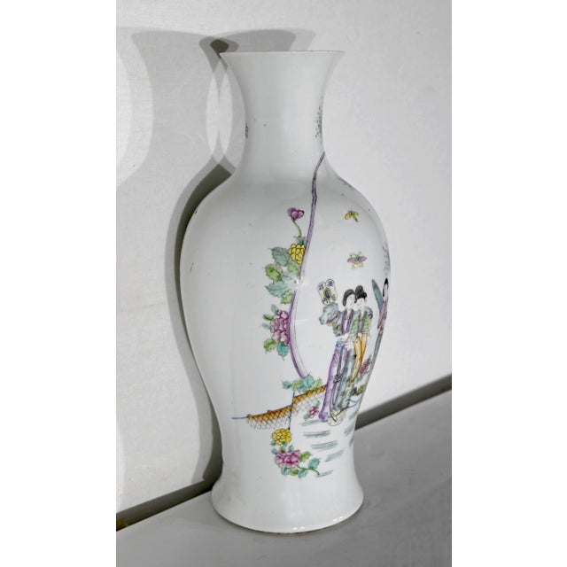 Important Chinese porcelain baluster vase, with a narrowed neck, the front part of which is decorated with a scene of life...