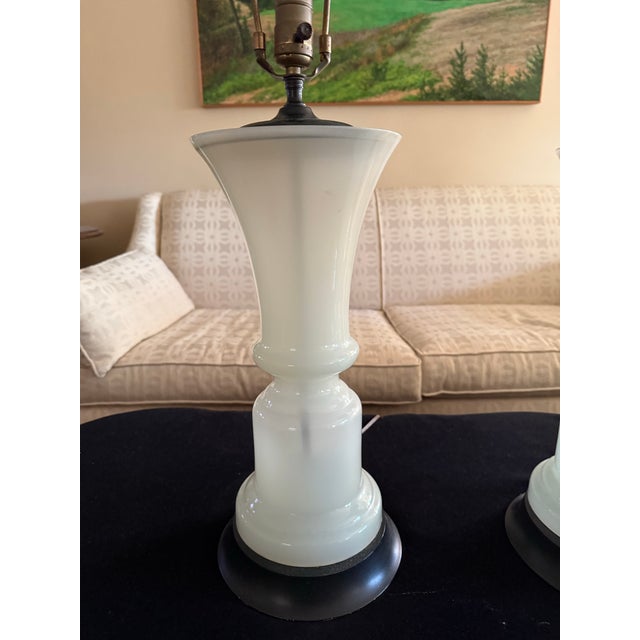 Magnificent pair of tall vintage opaline glass table lamps. This unique pair of lamps will make a statement in whatever...