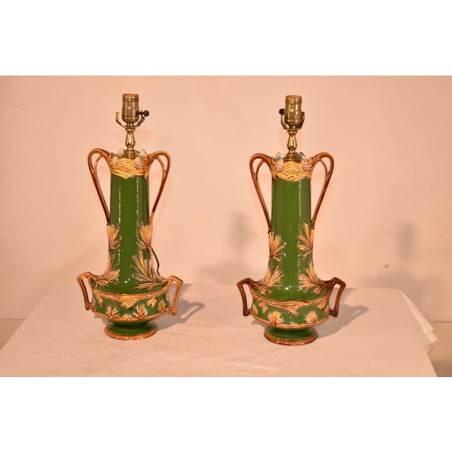 Pair of 19th century majolica vases from France which have been converted to lamps previously. This is a pair of gorgeous...