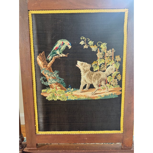 Listing is for a Victorian style needlepoint firescreen. The hand stitched needlepoint depicts a dog engaging with a...