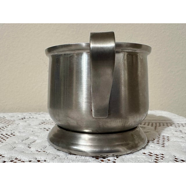 Vintage 1900s stainless steel sugar dish featuring a rounded body, pedestal base and two with 2 handles.