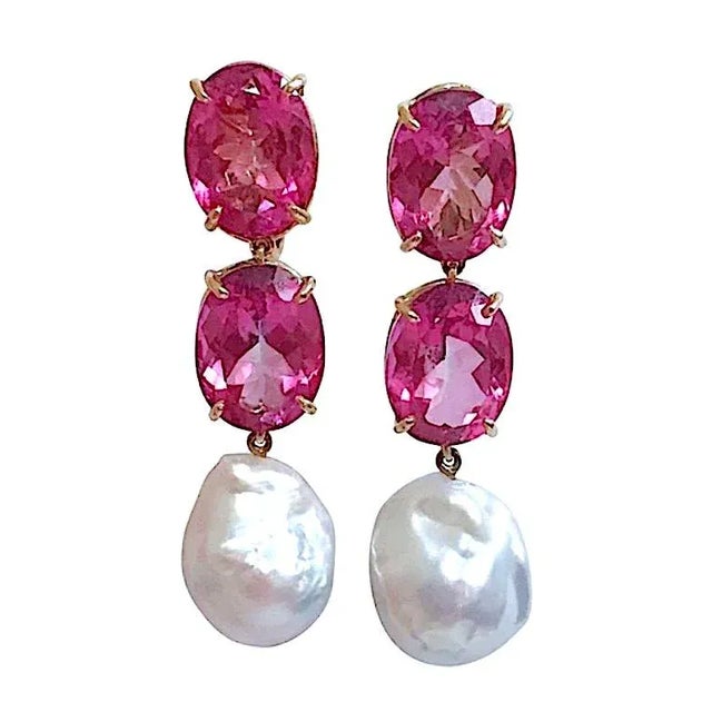 Christina Addison 18kt Yellow Gold Elegant Three Stone Drop Earrings with two faceted Pink Topaz and Baroque Pearl. The...