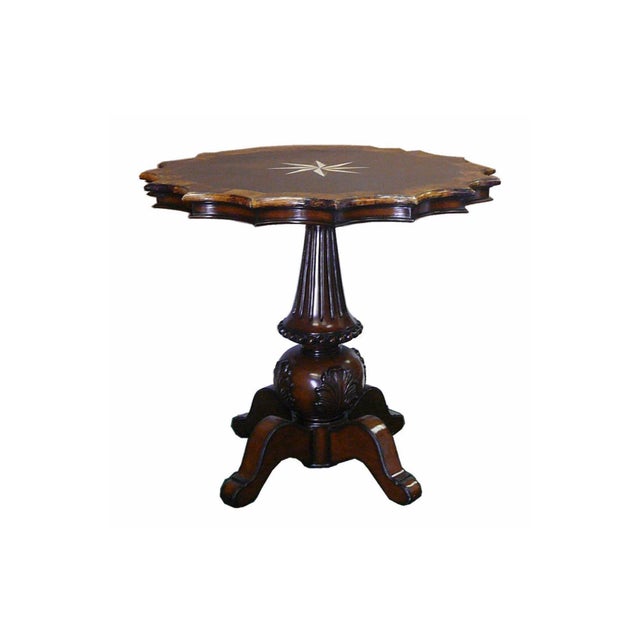 Elevate your space with this beautifully handcrafted pedestal table, designed with a striking star-shaped top. At the...