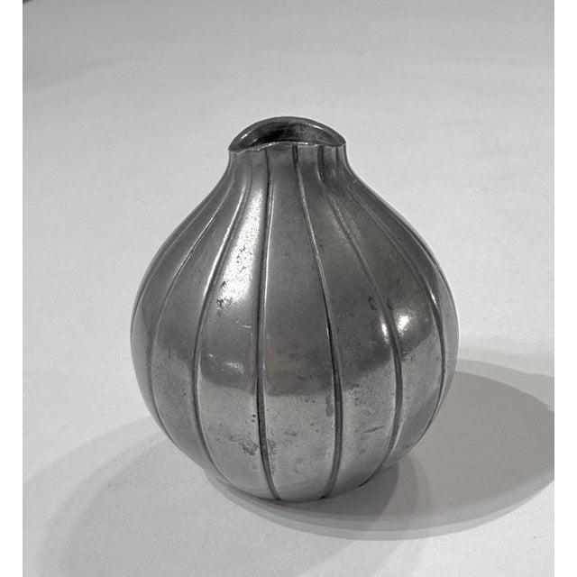 This is a sweet little pewter vase designed by Arne Ekers - made by Just Andersen in Copenhagen, Denmark. It is a refined...