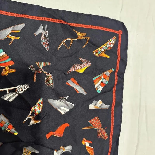 This is a beautiful and iconic 1980s Salvatore Ferragamo silk scarf featuring a vibrant pattern of different shoe designs....