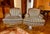 Elegant pair of 20th-century armchairs, or bergères, featuring carved wood frames and upholstered in handsome brown-and-...