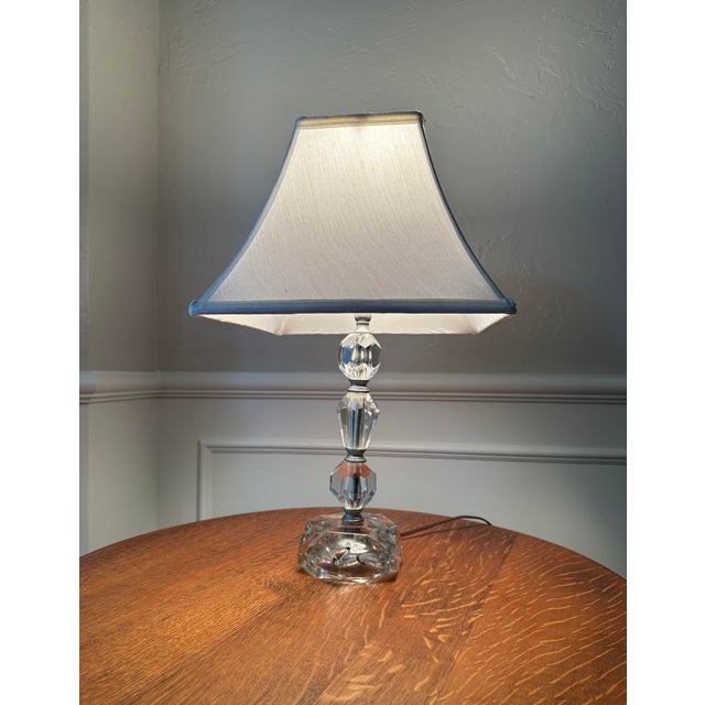 This elegant midcentury vintage lamp features stacked prismatic clear leaded glass crystals for a sparkling display. It is...
