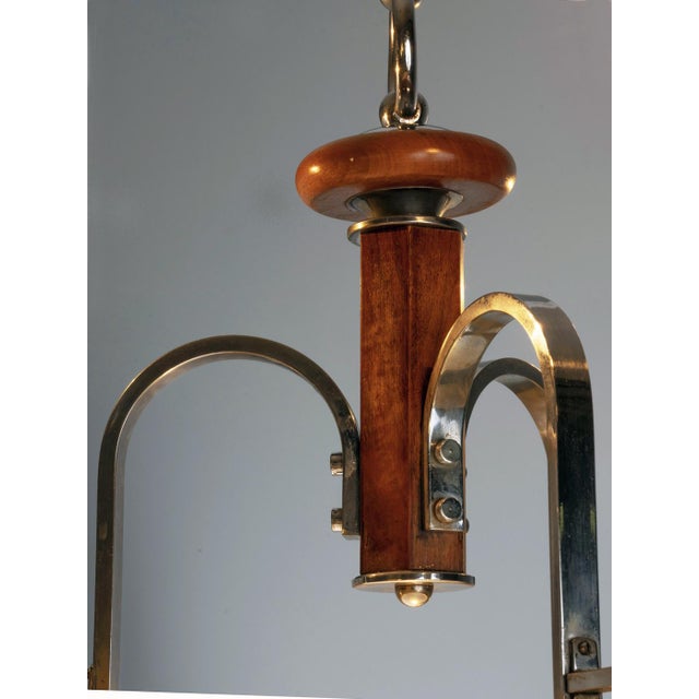 This four-lamp chandelier is a representative example of functionalist lighting from the 1930s–1940s, characterized by...