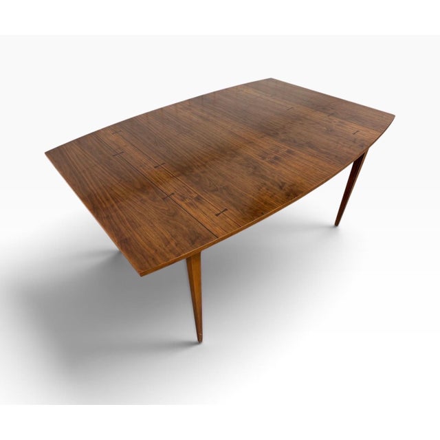 A beautiful Mid-Century Modern Lane “Tuxedo” walnut dining table, circa 1960s. This classic design showcases rich walnut...