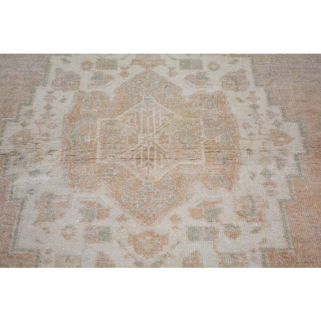Hand-knotted with care using traditional rug-making techniques, this wool rug blends timeless craftsmanship with a modern...