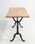 A striking example of early 20th-century French industrial craftsmanship, this bistro side table pairs the robust solidity...