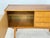 Beautiful vintage sideboard from the 1960s. This piece of furniture impresses with its clean lines, elegant wood grain,...