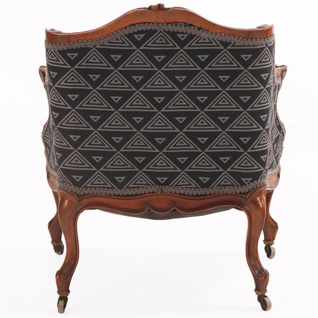 Featuring a beautifully sculpted frame with flowing cabriole legs, floral carvings, and gracefully shaped arms. Newly...