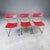 Striking set of three vintage modern stacking chairs dating to approximately the 1970s–early 1980s. Each chair features a...