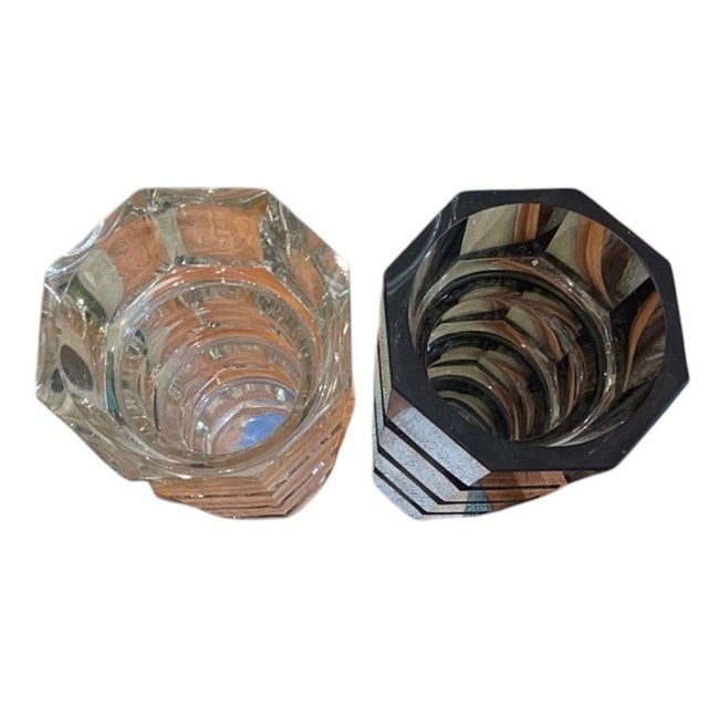 Elegant pair of 1930's Art Deco cut crystal vases in the manner of Josef Hoffmann for Moser. The pair includes one clear...