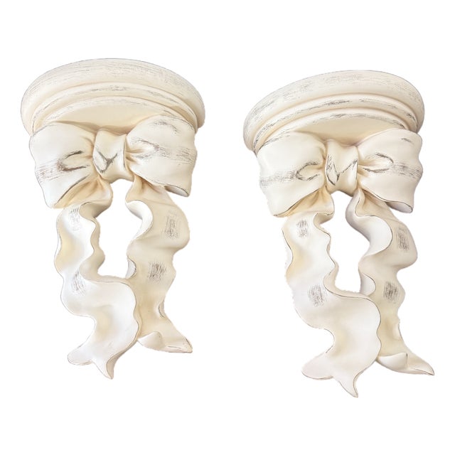 Designer Curated Vintage Hollywood Regency Distressed Cream & Gold Ribbon Bow Wall Shelves - Pair For Sale