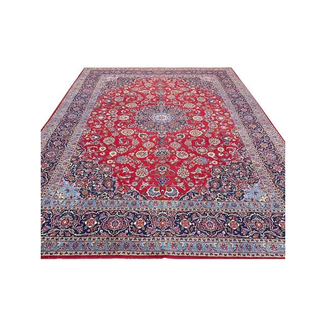 Experience the beauty of the 10x13 Old Persian Kashan Area Rug, an original addition that brings traditional charm and...