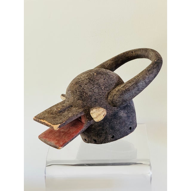 A zoomorphic mask in the stylized form of a water buffalo. Ceremonial object of the Chamba people. Nigeria circa 1970.