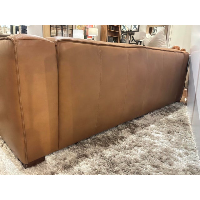 Stylish Hooker Furniture Maria Leather Sofa. Cognac color leather, thick arms. Original Retail $4480. Showroom floor sample.