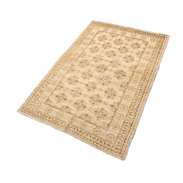 Crafted with a sleek, thin profile, this small area rug from the Ariana Samarkand Collection highlights an elegant semi-...