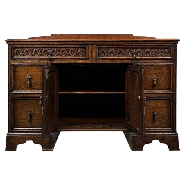 A handsome and substantial early 20th-century English Edwardian desk, finely constructed in oak and distinguished by...