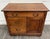 This is a gorgeous antique early-1900s Arts & Crafts oak washstand featuring three dovetailed drawers, a paneled cabinet...