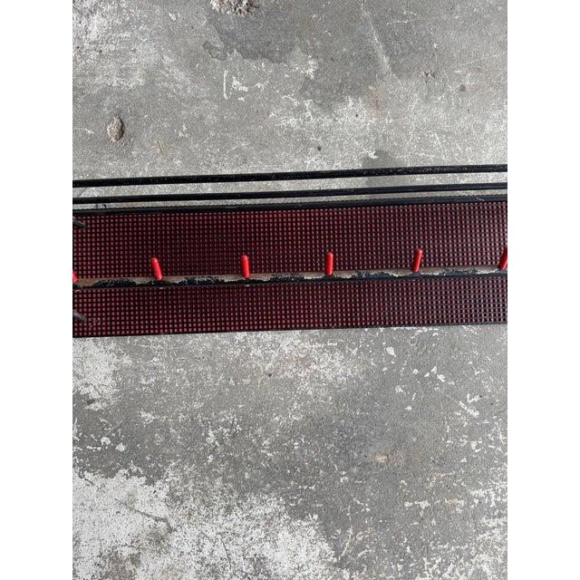 Mid-century wall-mounted coat rack – red and black, 1960s a striking mid-century coat rack featuring a perforated metal...