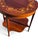 This 19th Century English Sheraton Mahogany Marquetry Center Table is a classic and elegant piece of antique furniture....