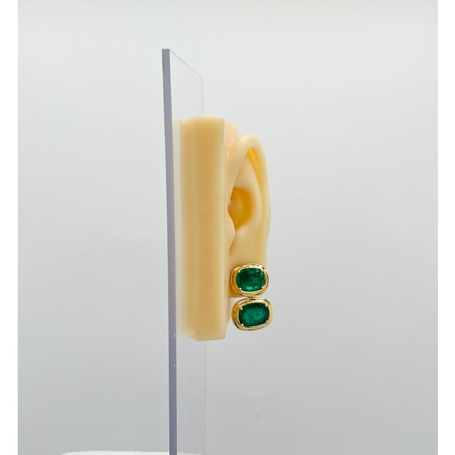 Gorgeous 17.33 ct. emerald cushions. Handmade in 18k yellow gold double bezel and prongs. Push back setting.