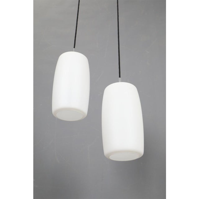 Lyfa, 1950s/1960s, denmark. Lampshades made of matt opal glass. Suspension made of aluminum and steel. Dimensions each:...