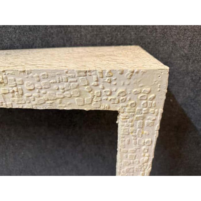 This wall console is an example of sculptural minimalism; this console table combines architectural form with artistic...