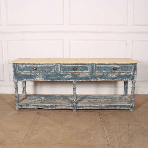Good 19th century English painted 3 draw popboard dresser base with a scrubbed pine top. 1810. This piece is designed in...