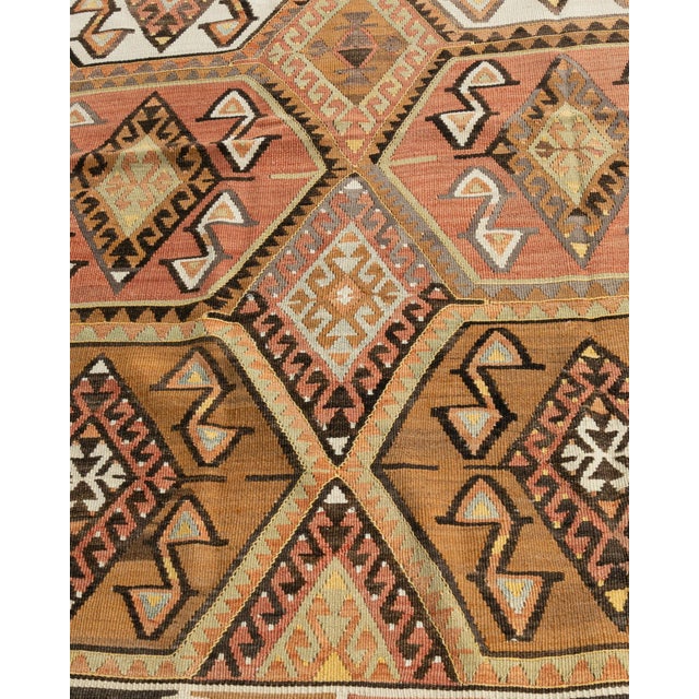 This vintage Turkish flat weave Kilim was hand-woven in the 1940's. The simplicity and boldness of this piece can also...