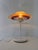 Classic Danish table lamp inspired by the designs of Poul Henningsen. The characteristic multi-layered shade with a red...