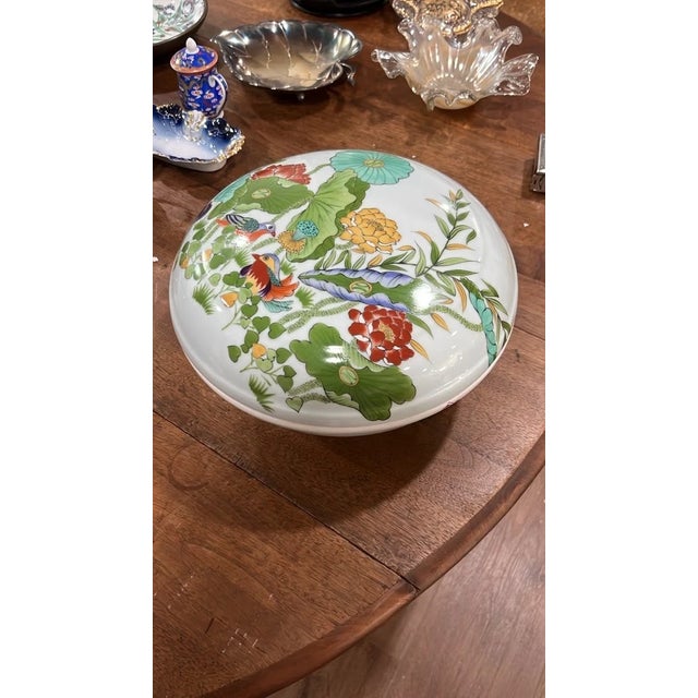 Add a splash of vibrant color and traditional artistry to your collection with this vintage Chinese lidded porcelain bowl....