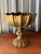 Hollywood Regency-style vintage scalloped and fluted brass pedestal compote bowl. It is commonly used as a tabletop floral...
