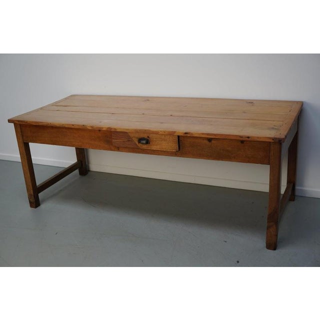 This elegant table was made in France in the late 19th century. The table was made in cherry with beautiful grain...