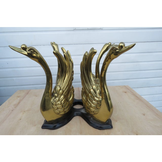 This beautiful Coffee Table is made of brass/iron base, glass top, and it is in good condition. The table has Hollywood...