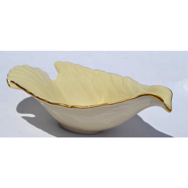 The Lenox dove candy dish is a collectible Fine Bone china or tan porcelain dish, adorned with 24K gold trim, crafted in...